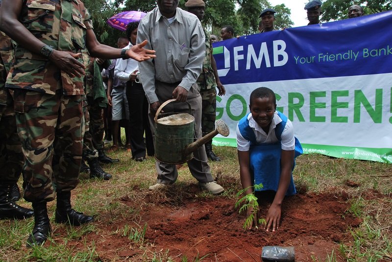 A student participates in the FMB Go Green Campaign at Cobbe Barracks in Zomba